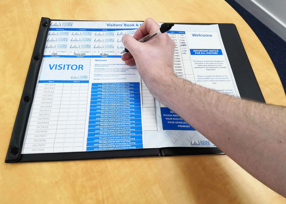 hand-signing-on-visitor-sign-in-log-book